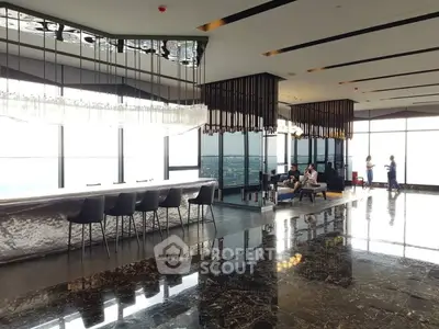 Luxurious high-rise living room with panoramic city views and elegant modern design.