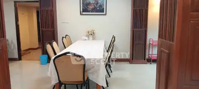 Spacious dining area with elegant table setting and classic decor
