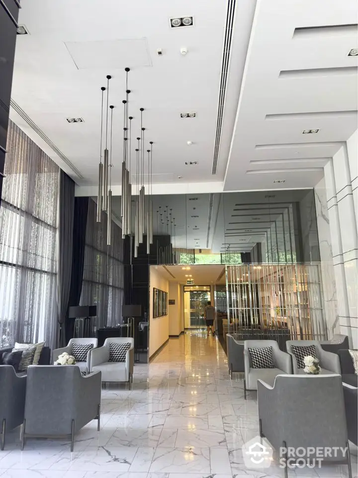 Luxurious modern lobby with high ceilings and elegant seating area