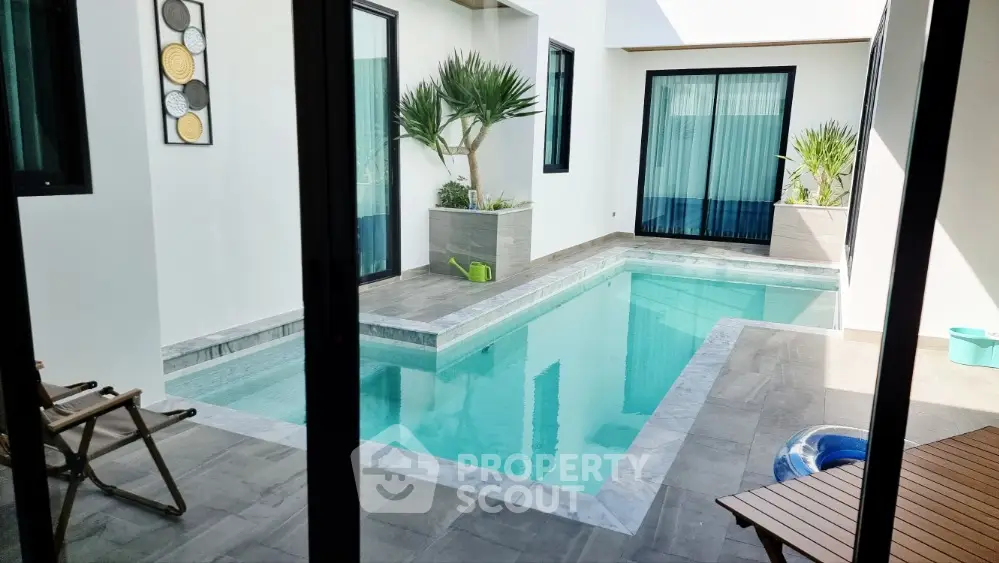 Luxurious modern home with private pool and stylish patio area