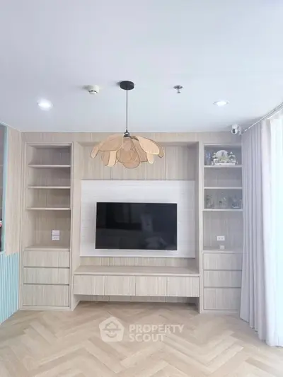 Modern living room with built-in entertainment center and stylish lighting