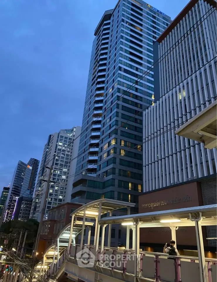 Stunning cityscape view of modern high-rise buildings at dusk, showcasing urban architectural elegance.