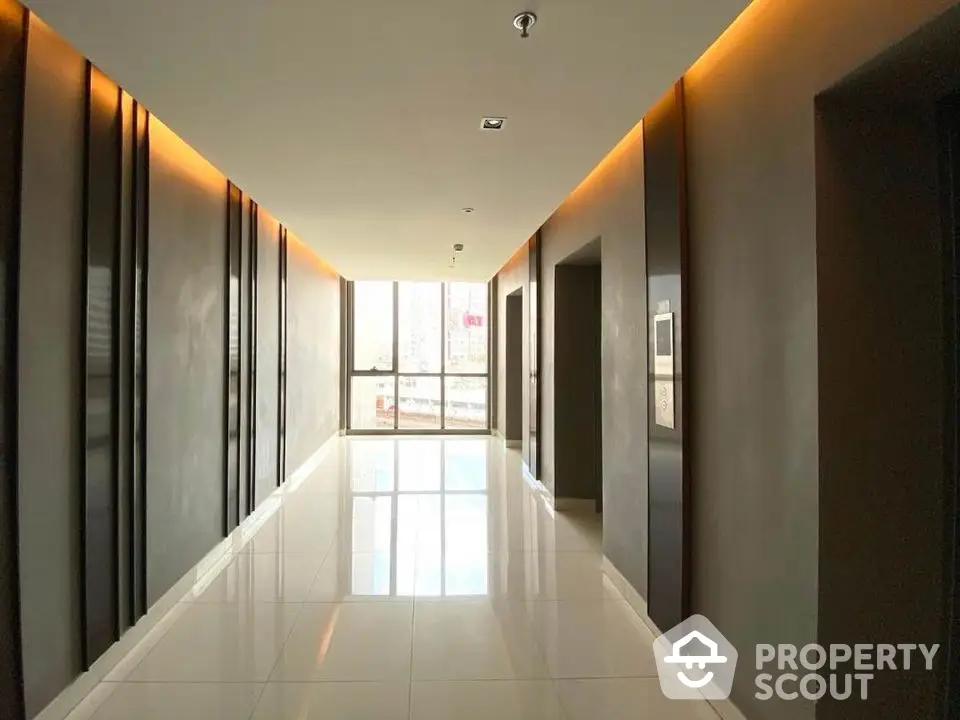 Modern apartment building hallway with sleek design and ambient lighting