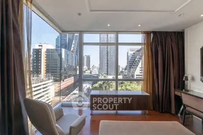 Luxurious high-rise apartment with stunning city view and elegant interior design.