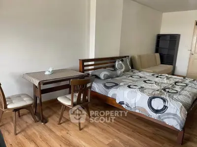 Cozy studio apartment with wooden flooring and modern furniture