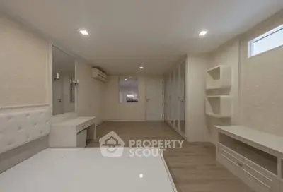 Spacious bedroom with modern design and ample storage solutions