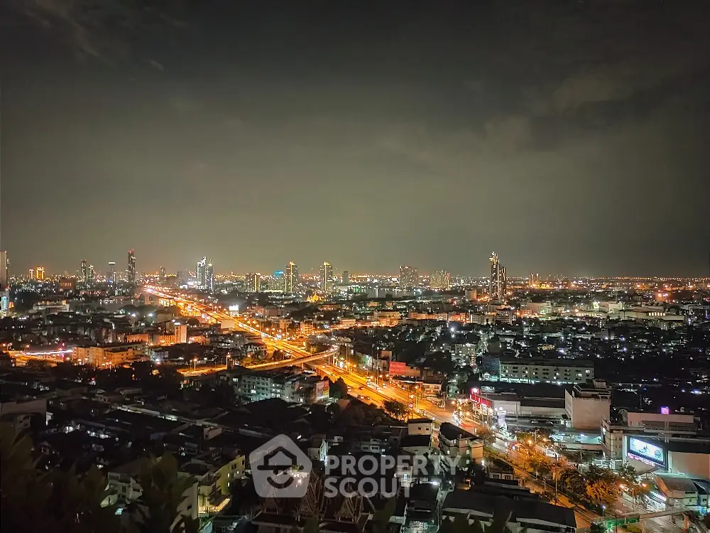 Stunning cityscape night view with illuminated skyline and vibrant urban lights.