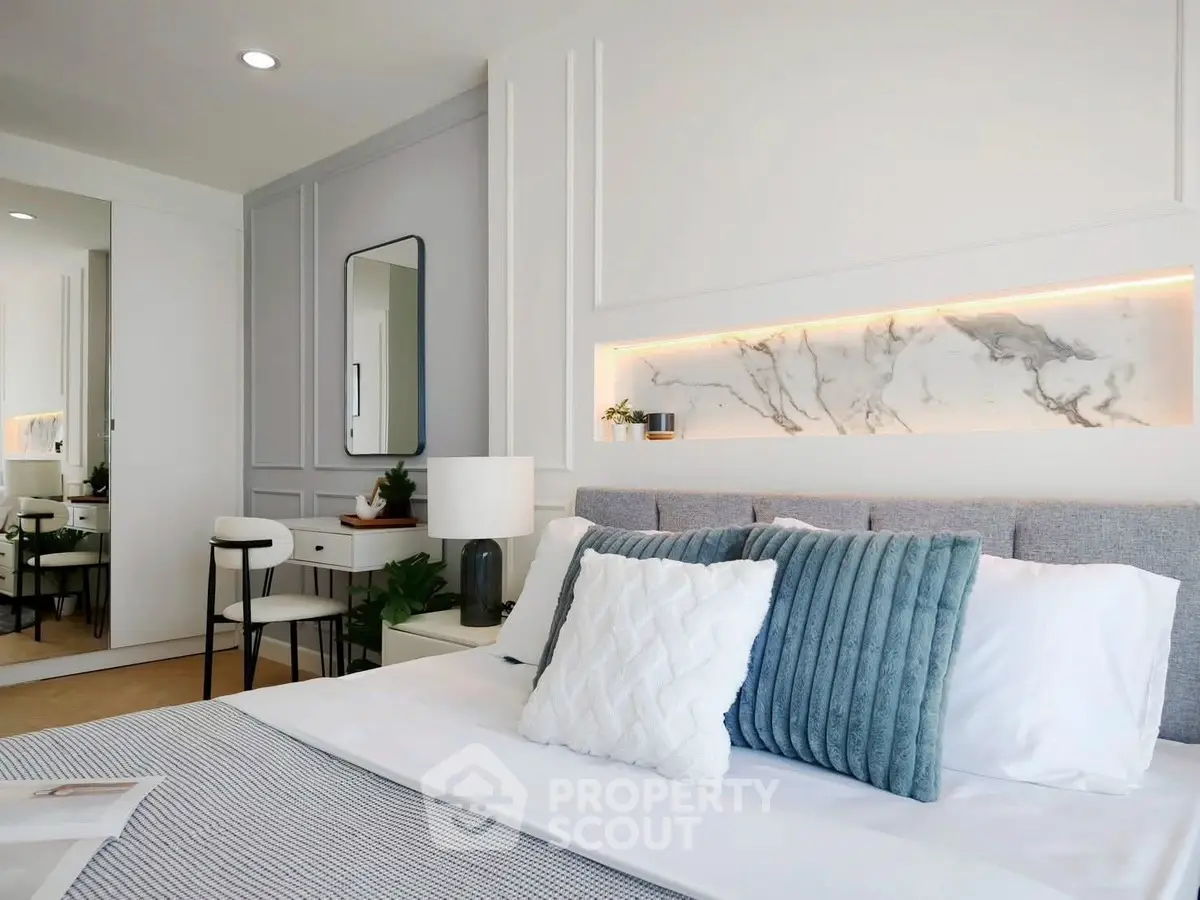 Elegant modern bedroom with stylish decor and ambient lighting