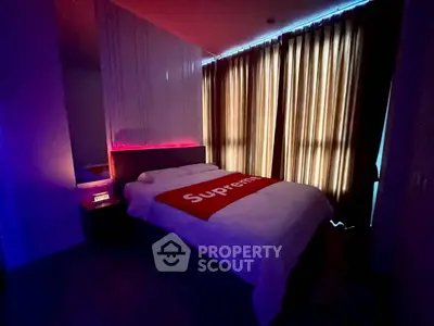 Modern bedroom with ambient lighting and stylish decor