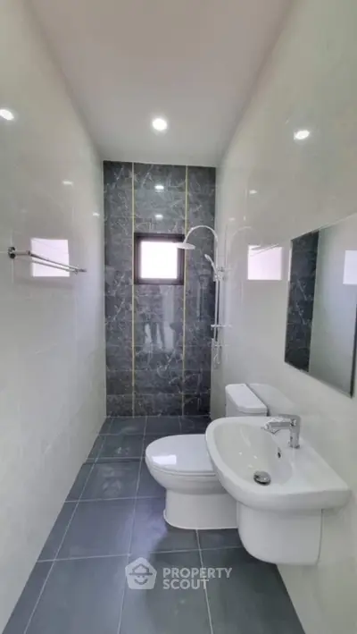 Modern bathroom with sleek fixtures and elegant marble accents