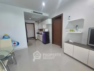 Modern living room with sleek furniture and open kitchen layout