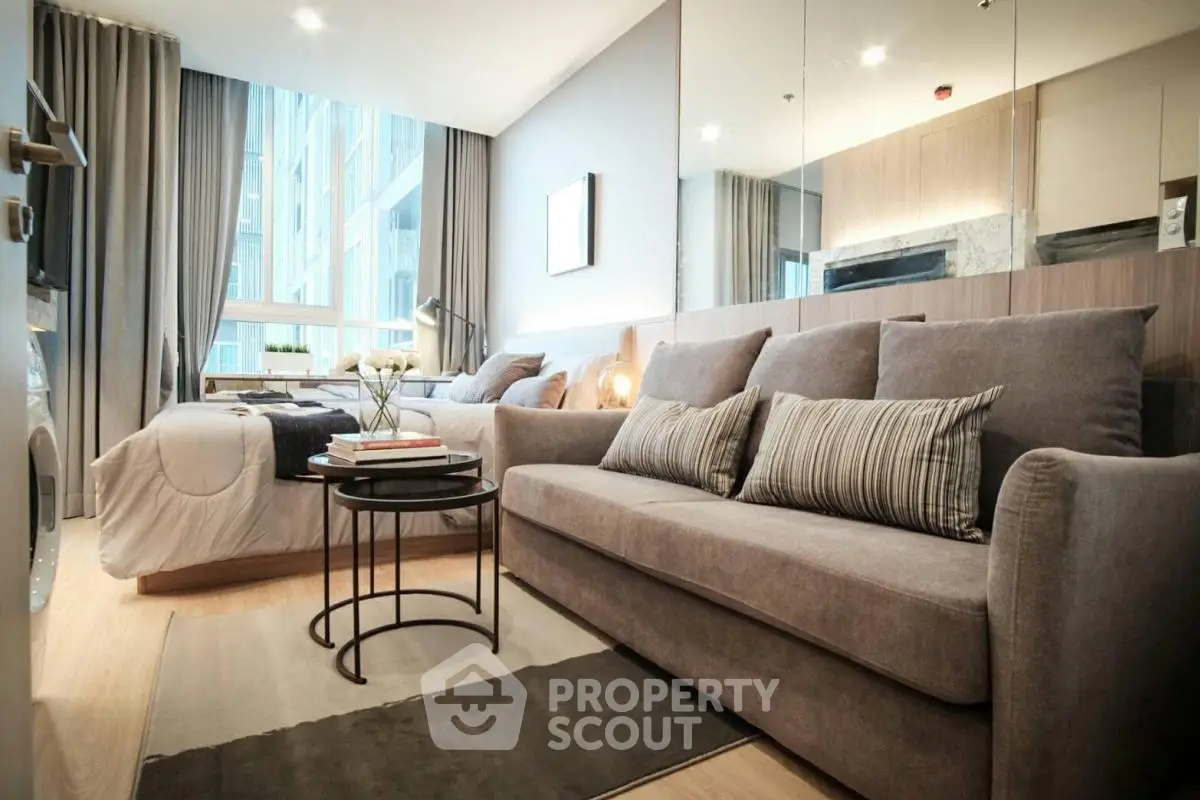 Modern studio apartment with cozy living area and stylish decor