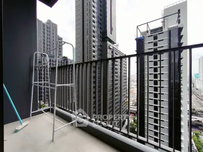 Modern high-rise balcony with cityscape view, perfect for urban living enthusiasts.