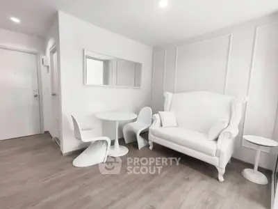 Modern minimalist living room with white furniture and sleek design