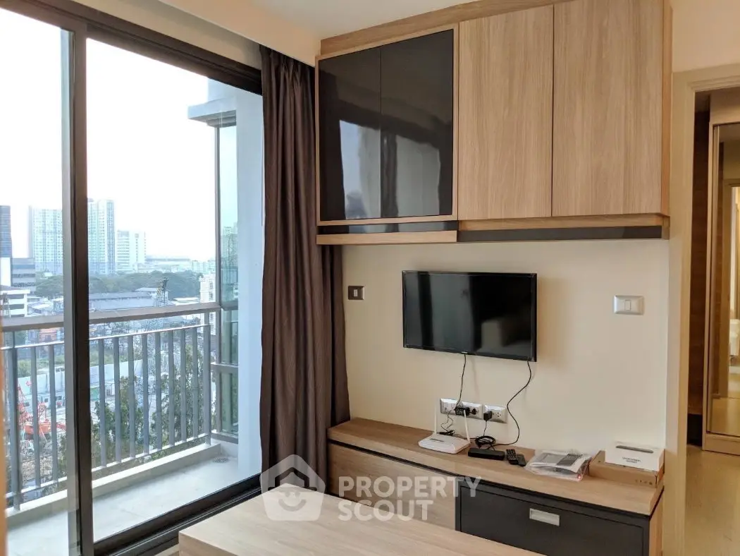 Modern living room with city view and sleek furniture in high-rise apartment
