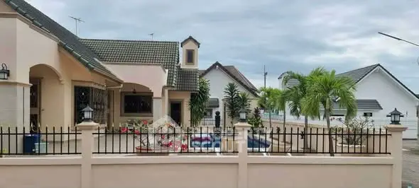 Charming suburban home with lush garden and elegant architecture.