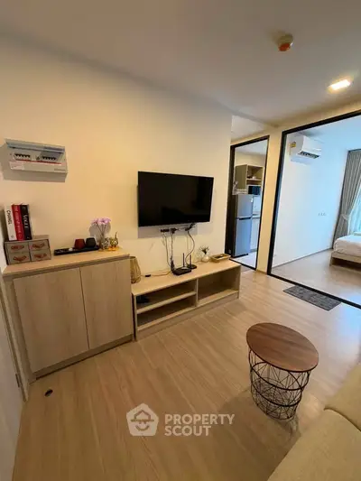 Modern living room with TV and stylish decor in a cozy apartment