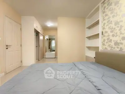 Spacious bedroom with modern decor and built-in storage solutions