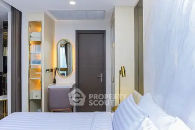 Modern bedroom with elegant decor and cozy ambiance, featuring a stylish desk and mirror.