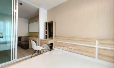 Modern bedroom with sliding glass doors and minimalist furniture design