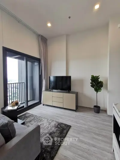 Modern living room with balcony view and sleek interior design