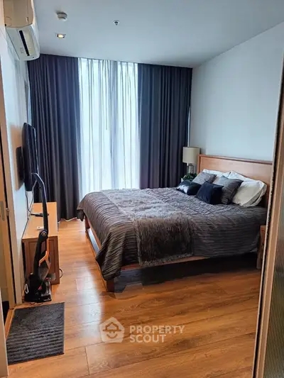 Modern bedroom with stylish decor and natural light