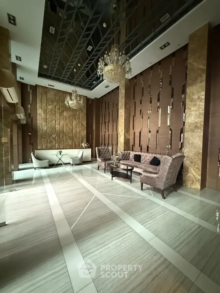 Luxurious living room with elegant chandeliers and modern decor in a high-end property.