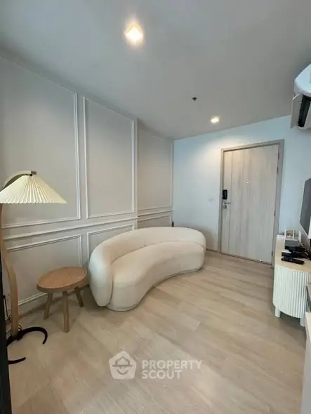 Stylish modern living room with curved sofa and elegant decor