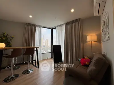 Modern living room with city view, stylish furniture, and natural light