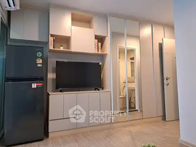 Modern living room with sleek cabinetry and built-in TV unit