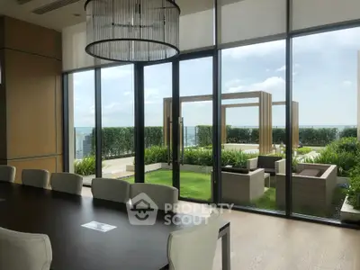 Luxurious dining area with stunning garden view and modern outdoor seating.