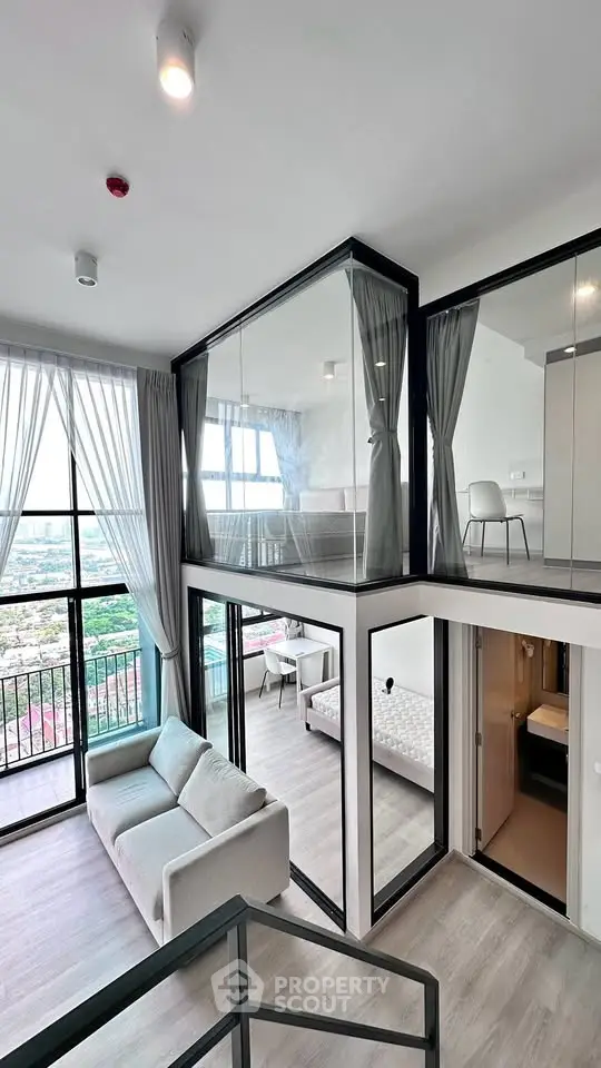Modern duplex apartment with floor-to-ceiling windows and stylish interior design