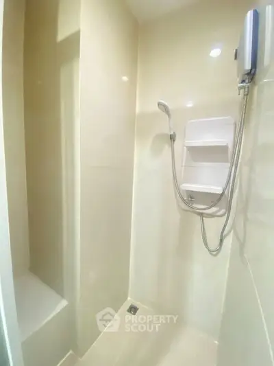 Modern bathroom with sleek shower design and built-in shelving