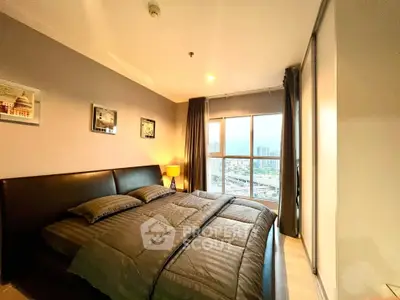 Modern bedroom with city view, cozy ambiance, and stylish decor.