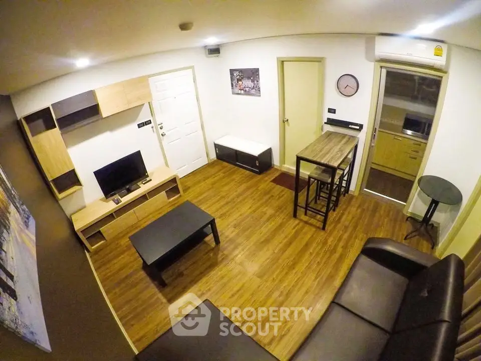 Modern living room with wooden flooring and stylish furniture