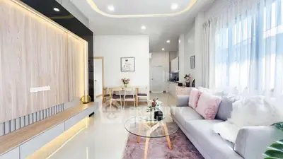 Modern living room with stylish decor and open kitchen layout