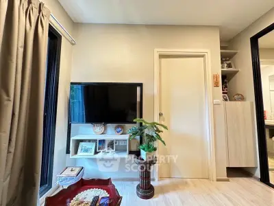 Modern living room with wall-mounted TV and stylish decor