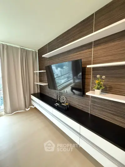 Modern living room with sleek TV unit and stylish shelving