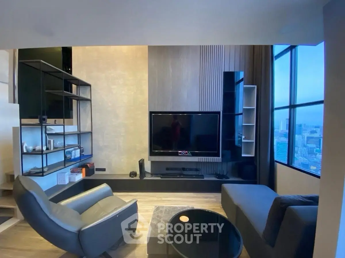 Modern living room with sleek furniture and city view, featuring a large TV and stylish shelving.