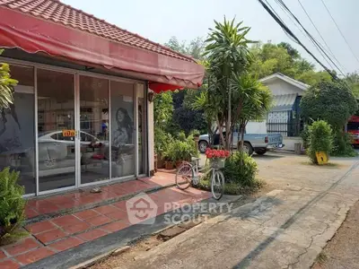 Charming suburban property with red-tiled roof and lush greenery, ideal for tranquil living.