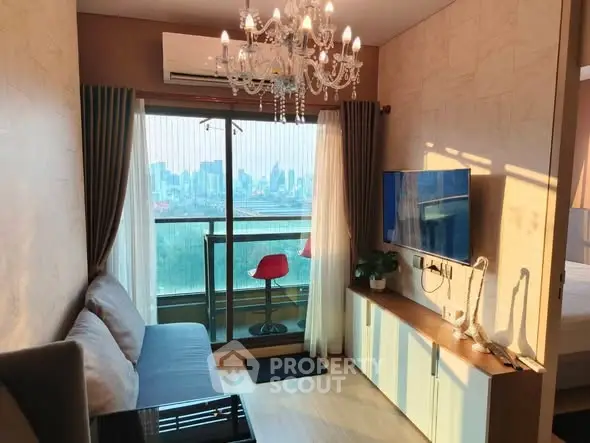 Chic living room with city view, chandelier, and modern decor