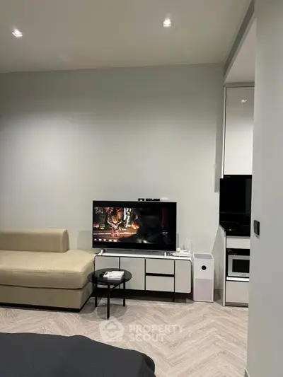 Modern living room with sleek furniture and entertainment setup