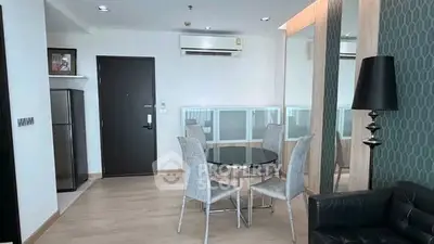 Modern living room with sleek furniture and stylish decor in a contemporary apartment.
