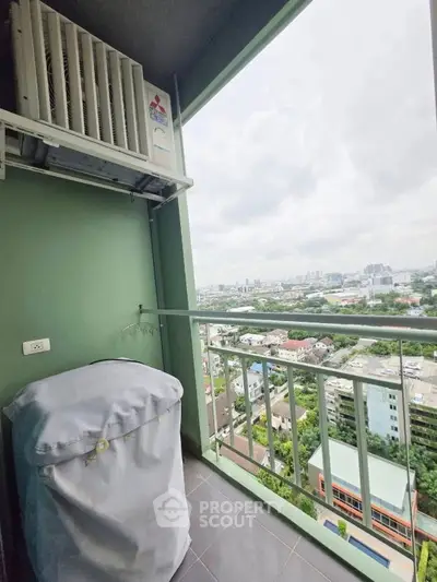 High-rise balcony with city view and covered washing machine