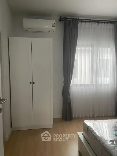 Modern bedroom with air conditioning and natural light