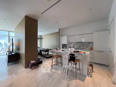 Luxurious open-layout kitchen with marble island and stunning city view in modern apartment