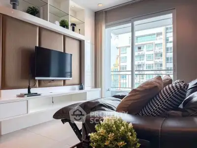 Modern living room with sleek TV setup and large window view