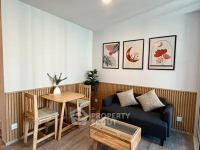 Charming living room with modern decor, cozy seating, and stylish wooden furniture, perfect for relaxation.