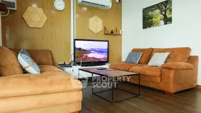 Cozy living room with modern decor and comfortable seating