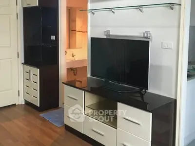 Modern living room with sleek TV stand and hardwood floors
